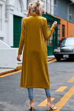 Mustard yellow velvet duster coat with long sleeve length and pockets