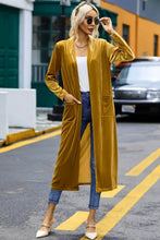 Mustard yellow velvet duster coat with long sleeve length and pockets