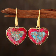 Pair of natural stone heart drop earrings with red turquoise speckles in gold tone