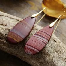 Natural stone waterdrop shape earrings with red and brown striped stones and gold hooks