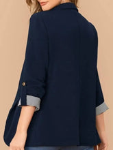 Navy blue blazer with rolled sleeve length and pocket detail