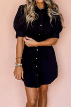 Navy blue puff sleeve mini shirt dress with belt, pockets and pearl bracelet