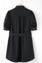 Navy blue puff sleeve mini shirt dress with belt, pockets, and button details