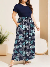 Navy floral maxi dress with round neck, short sleeves and pockets