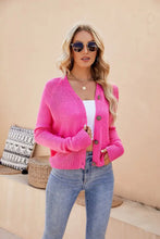 Neon pink ribbed knit cardigan with long sleeve length and button details