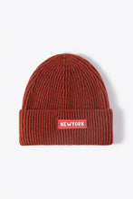 Reddish-brown rib-knit cuffed beanie with Newyork patch