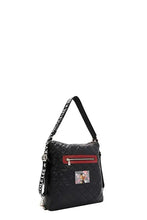 Nicole Lee USA backpack bag with black quilted design, red zippered pocket, colorful character patch, and convertible adjustable strap