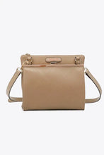 Nicole Lee USA pebbled vegan leather handbag with flap closure, adjustable strap, and compartment features