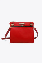 Nicole Lee USA pebbled vegan leather handbag with red quilted crossbody design, gold clasp, and compartment features