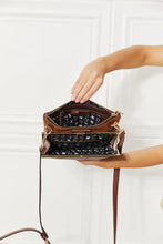Nicole Lee USA pebbled vegan leather handbag with brown exterior, black interior, silver hardware, and compartment features