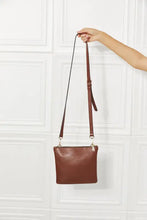 Nicole Lee USA pebbled vegan leather handbag with brown leather, silver hardware, and compartment features