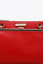 Nicole Lee USA pebbled vegan leather handbag with red quilted design, gold clasp and compartments