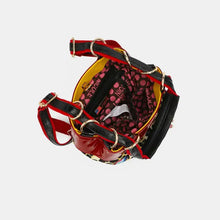 Nicole Lee USA vegan leather leopard print bucket handbag with red black patent exterior and patterned lining