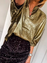 Shimmering gold metallic notched sleeve blouse with relaxed fit and three quarter sleeves for elegant wear