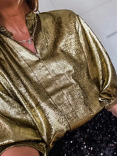 Notched 3/4 sleeve blouse in shimmering gold metallic satin with a soft texture and relaxed fit