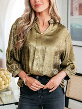 Notched 3/4 sleeve blouse in shimmering olive green satin with subtle texture and puffed sleeves