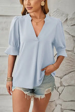 Light blue women’s notched half sleeve tunic blouse with puff sleeves