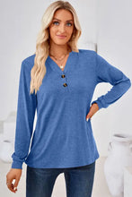 Women’s notched long sleeve blue henley shirt with brown buttons