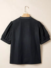 Black notched puff sleeve blouse with short puffed sleeves and ribbed collar trim in soft fabric