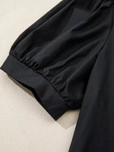 Black smooth-textured notched puff sleeve blouse with gathered cuff made of soft fabric