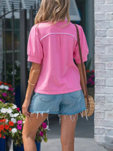 Pink notched short puff blouse with white trim and short puff sleeves in lightweight fabric for stylish wear