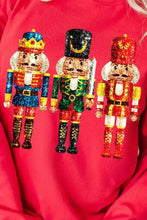 Nutcracker printed round neck red long sleeve sweatshirt with glittery figures