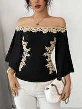 Black off-shoulder embroidered bell sleeve blouse with delicate gold lace detailing along neckline and sides