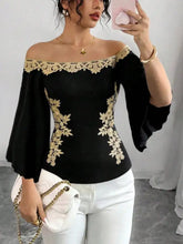 Black off-shoulder top with gold floral lace embroidered bell sleeves featuring elegant embroidery details