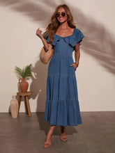 Blue denim dress with shoulder ruffle tiered sleeves and square neckline in a midi length style
