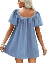 Light blue denim mini dress with puffed sleeves and square neckline in off-shoulder tie-front denim style