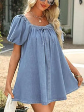 Light blue off-shoulder tie-front denim dress with puffed sleeves and gathered neckline mini denim dress