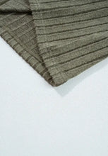 Olive green ribbed knit top with leopard shoulder accents and semi-sheer stretch