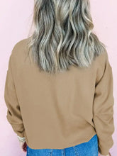 Olive green cropped sweatshirt with long sleeves, fuzzy trim, metallic accents, relaxed fit