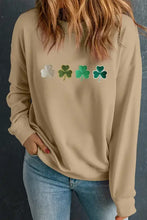 Beige long-sleeved shamrock sweatshirt with fuzzy trim and metallic accents