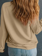 Olive green shamrock sweatshirt with fuzzy trim, metallic accents, and relaxed fit