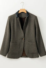 Olive green textured wool blazer with black buttons and pocket details
