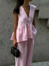 Soft pink linen sleeveless top with v-neck and peplum hem in One Button Set