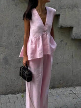 Soft pink linen sleeveless top with peplum hem in One Button Set
