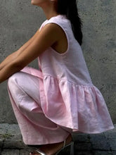 Soft pink linen sleeveless top with ruffled hem and cut-out shoulders from One Button Set