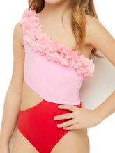 One-shoulder pink and red contrast swimsuit with floral ruffles