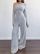 Stylish gray ribbed off-shoulder jumpsuit with fitted bodice and wide-leg pants