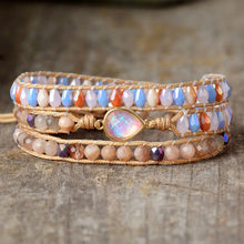 Opal beaded bracelet with iridescent teardrop pendant and bronze clasp