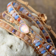 Opal beaded bracelet with iridescent teardrop pendant and bronze clasp