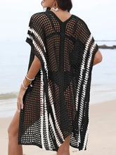Black crochet-knit beach cover-up with white stripes and contrast openwork