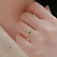 Sterling silver open ring with marquise green gemstone and clear accents