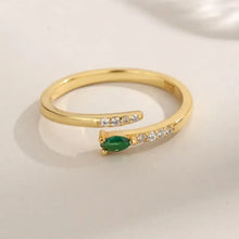 Sterling silver open ring with marquise green gemstone and clear accents