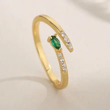 Sterling silver open ring with marquise green gemstone and clear accents