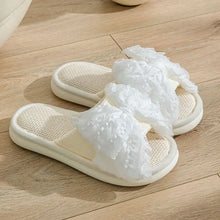 White open-toe flats slippers with ruffled floral straps and woven insoles