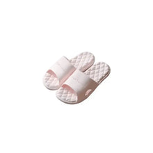 Pair of light pink open toe flats slippers with quilted soles