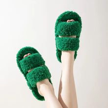 Pair of fuzzy green open toe flats slippers with two straps